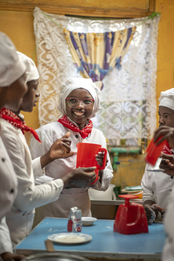 Jane Njeri (C) a trainee at Peniel catering school in Gachie Kiambu county and a group of other students practicing how to bake cookies and white bread.<br /> Peniel has been taught on product development and business modelling and has trained over 500 young people to start their own enterpises in baking.