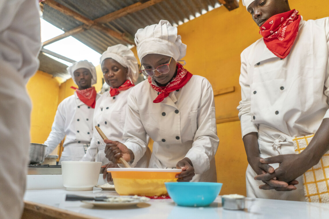 Jane Njeri (C) a trainee at Peniel catering school in Gachie Kiambu county and a group of other students practicing how to bake cookies and white bread.<br /> Peniel has been taught on product development and business modelling and has trained over 500 young people to start their own enterpises in baking.